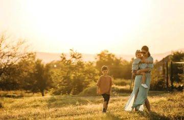 Mother and children at sunset