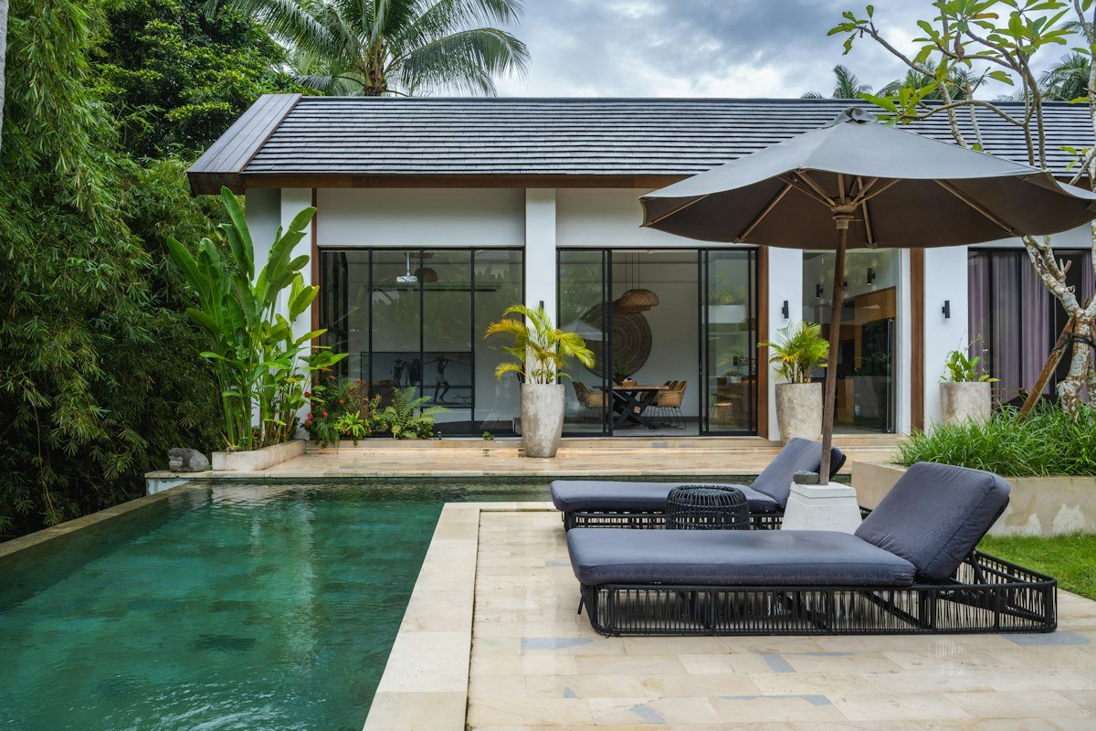 Illustrative poolside lifestyle photograph; not an advertised property